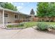 Artificial grass yard, covered patio and drought tolerant garden offer low maintenance enjoyment at 4438 S Elati St, Englewood, CO 80110