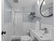 Finished basement bathroom featuring a stand up shower with subway tile and tiled floors at 4438 S Elati St, Englewood, CO 80110
