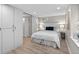Basement bedroom features a queen size bed, small window and access to the basement bathroom at 4438 S Elati St, Englewood, CO 80110