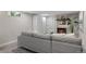 Cozy basement living room with a modern fireplace and sleek gray sofa at 4438 S Elati St, Englewood, CO 80110