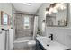 Stylish bathroom featuring a shower-tub combo with subway tile and modern vanity at 4438 S Elati St, Englewood, CO 80110