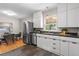 Open kitchen featuring stainless steel appliances and a dining area at 4438 S Elati St, Englewood, CO 80110