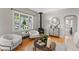 Cozy living room with bright window, hardwood floors and modern furniture at 4438 S Elati St, Englewood, CO 80110