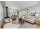 Bright living room features hardwood floors and a cozy seating area with a pellet stove at 4438 S Elati St, Englewood, CO 80110