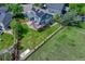 Aerial view of a house with solar panels, deck, large yard, and backyard patio at 901 Sage Sparrow Cir, Highlands Ranch, CO 80129