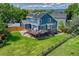 Aerial view of a home with solar panels, a well-kept lawn, and a backyard deck at 901 Sage Sparrow Cir, Highlands Ranch, CO 80129