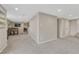 Finished basement showcasing gray walls, neutral carpet, a dining table, and an open layout at 901 Sage Sparrow Cir, Highlands Ranch, CO 80129