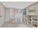 Finished basement playroom featuring gray walls, neutral carpet, and a play area at 901 Sage Sparrow Cir, Highlands Ranch, CO 80129