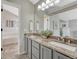Double vanity bathroom with granite countertops and ample cabinet storage at 901 Sage Sparrow Cir, Highlands Ranch, CO 80129
