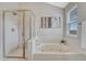 Bright bathroom boasts a soaking tub and separate shower stall at 901 Sage Sparrow Cir, Highlands Ranch, CO 80129