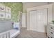 Bedroom with wallpaper and closet at 901 Sage Sparrow Cir, Highlands Ranch, CO 80129