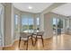 Eat-in kitchen area with a dining table overlooking views of lush green scenery at 901 Sage Sparrow Cir, Highlands Ranch, CO 80129