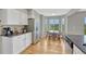 Eat-in kitchen with stainless steel appliances, dining table, and views of green scenery at 901 Sage Sparrow Cir, Highlands Ranch, CO 80129