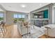 Living room with a fireplace, and a walk out balcony with views of nature at 901 Sage Sparrow Cir, Highlands Ranch, CO 80129