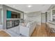 Living room with a fireplace, a TV, and a gray sofa at 901 Sage Sparrow Cir, Highlands Ranch, CO 80129