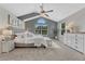 Spacious main bedroom with vaulted ceiling, large windows and neutral color palette at 901 Sage Sparrow Cir, Highlands Ranch, CO 80129