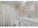 Well-lit bathroom featuring a shower-tub combo with a white tile surround and neutral wall paint at 12142 Melody Dr # 301, Denver, CO 80234