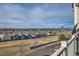 Balcony with neighborhood views, overlooking a nearby street and landscape at 2705 S Danube Way # 306, Aurora, CO 80013