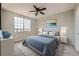 Bedroom featuring a large window and comfortable bed with soft lighting for relaxation at 2705 S Danube Way # 306, Aurora, CO 80013