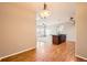 Dining room featuring hard wood floors, an open space, and views to other rooms at 2705 S Danube Way # 306, Aurora, CO 80013