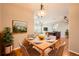Dining room showcasing a wooden table with seating for four and modern chandelier lighting at 2705 S Danube Way # 306, Aurora, CO 80013