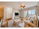 Comfortable living room with ceiling fan, plush seating, and a television for relaxation at 2705 S Danube Way # 306, Aurora, CO 80013