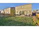 Spacious backyard with patio furniture set and lush lawn perfect for relaxation at 1908 Homestead Dr, Fort Lupton, CO 80621