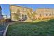 Well-maintained backyard with healthy grass and landscaping creates tranquil oasis at 1908 Homestead Dr, Fort Lupton, CO 80621