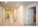 Bright hallway featuring neutral carpet, recessed lighting, and access to multiple rooms at 1908 Homestead Dr, Fort Lupton, CO 80621