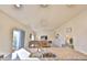 Open floorplan view features kitchen island, granite counters, and flows into the dining and living areas at 1908 Homestead Dr, Fort Lupton, CO 80621