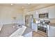 Modern kitchen features granite countertops, stainless steel appliances, and white cabinets at 1908 Homestead Dr, Fort Lupton, CO 80621