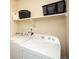 Practical laundry room equipped with a washer and dryer for convenient laundry care at 1908 Homestead Dr, Fort Lupton, CO 80621