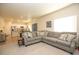 Spacious living room flows into the dining and kitchen areas, with ample seating and natural light at 1908 Homestead Dr, Fort Lupton, CO 80621