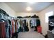 Spacious walk-in closet with ample storage shelves and rods for organized clothing at 1908 Homestead Dr, Fort Lupton, CO 80621