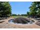 Beautiful tiered water fountain in a community gathering place and surrounding green spaces at 2958 Syracuse St # 316, Denver, CO 80238