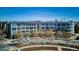 Aerial view of a modern apartment building with well-maintained landscaping and parking at 2958 Syracuse St # 316, Denver, CO 80238