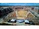 Aerial view of a neighborhood park with an outdoor stage and a charming gazebo at 2958 Syracuse St # 316, Denver, CO 80238