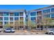 Modern building exterior showcases balconies and large windows, blending contemporary design with urban living at 2958 Syracuse St # 316, Denver, CO 80238