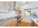 Well-equipped kitchen boasting granite countertops, stainless steel appliances, and plenty of cabinet space at 2958 Syracuse St # 316, Denver, CO 80238