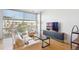 Cozy living room with large windows, modern furniture, and hardwood flooring at 2958 Syracuse St # 316, Denver, CO 80238