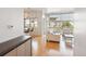 Well-designed living space with open floor plan and modern finishes connects the kitchen and living room seamlessly at 2958 Syracuse St # 316, Denver, CO 80238