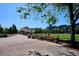 Landscaped walking path with benches near a park and open space in the community at 2958 Syracuse St # 316, Denver, CO 80238