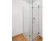 Glass enclosed shower boasts modern tile work and fixtures, making it stylish and functional at 2958 Syracuse St # 316, Denver, CO 80238