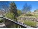Backyard view from the deck featuring vegetation and wooden fence at 6969 W Yale Ave # 81, Denver, CO 80227