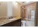 Bathroom featuring a granite vanity and a shower-tub combo at 6969 W Yale Ave # 81, Denver, CO 80227