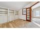 Bedroom featuring built-in shelving and a doorway at 6969 W Yale Ave # 81, Denver, CO 80227