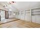 Bedroom featuring mirrored wall, built-in shelving, and neutral carpeting at 6969 W Yale Ave # 81, Denver, CO 80227
