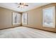 Bedroom featuring a ceiling fan, neutral walls, and shuttered windows at 6969 W Yale Ave # 81, Denver, CO 80227
