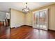 Dining room featuring hardwood floors, stylish lighting, and sliding doors to the outside at 6969 W Yale Ave # 81, Denver, CO 80227