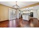 Open kitchen with granite island, stainless steel appliances, and sliding glass door at 6969 W Yale Ave # 81, Denver, CO 80227